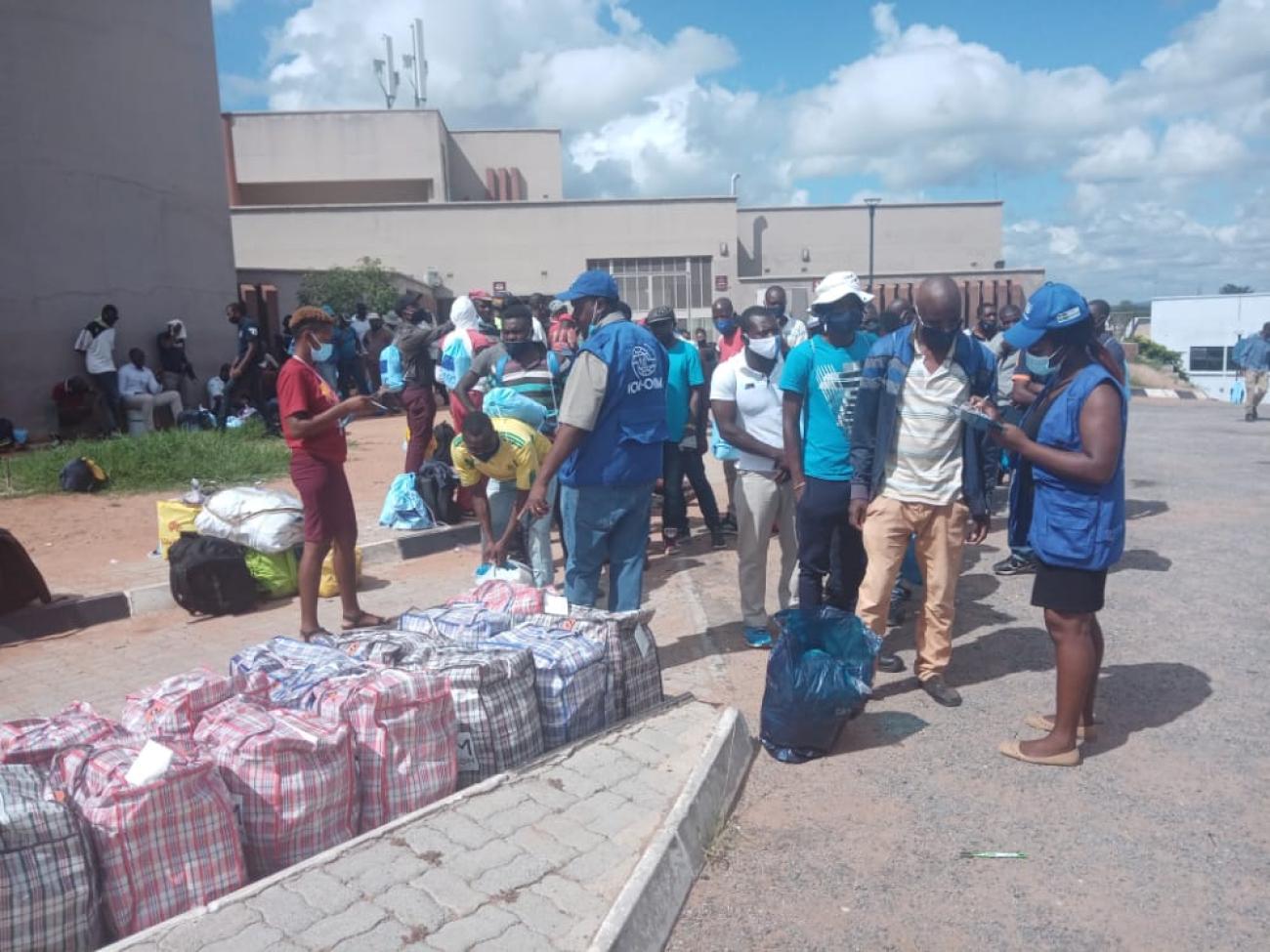 COVID-19 affected returning migrants receive post arrival support