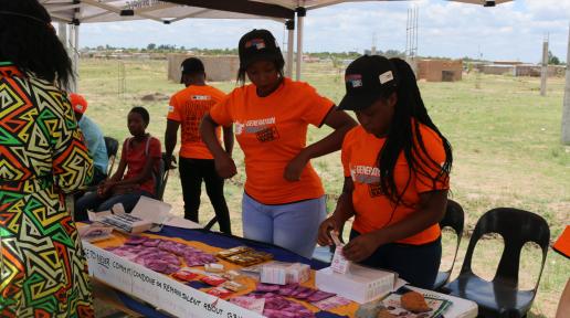 Service providers disseminating information at the launch of one-stop center campaigns